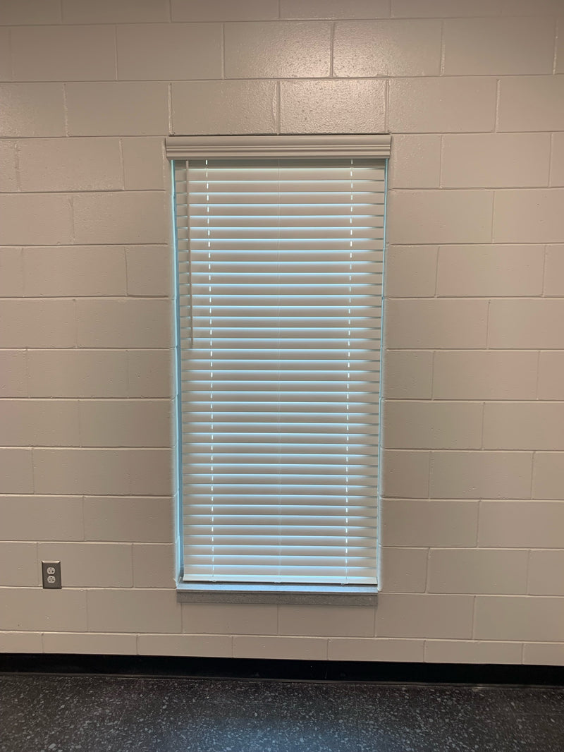 Customer installation - 2 inch faux wood blinds in a window