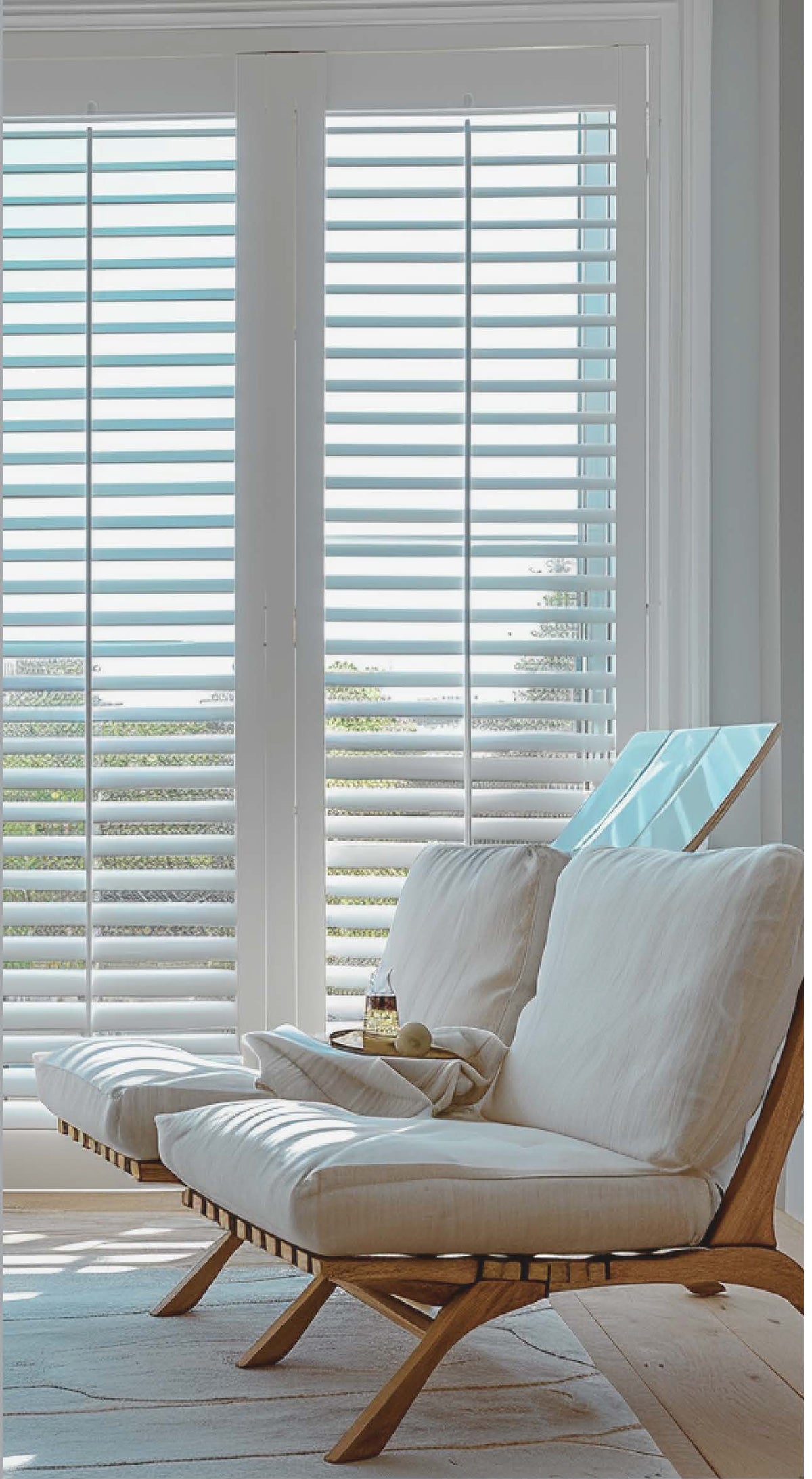 Bravada Louverstar Poly Interior Shutters - white poly shutters in a living room
