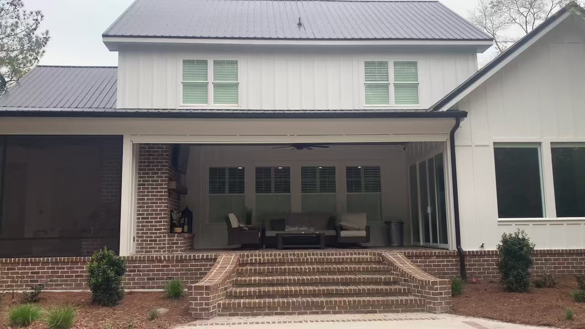 Customer installation - motorized exterior screen lowering over a porch