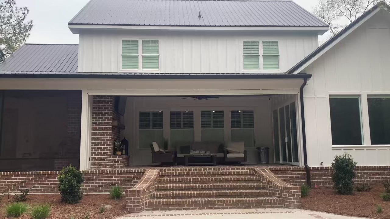 Customer installation - motorized exterior screen lowering over a porch