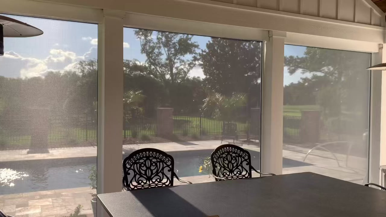 Customer installation - motorized exterior shades raising over a patio